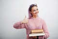 Student. Young woman with books. Nice girl is ready to learn