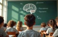 Students actively learn about human brain in classroom. Cognitive science lesson on sunny afternoon with blackboard diagram. Royalty Free Stock Photo