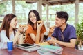 Students asian group together eating pizza in breaking time Royalty Free Stock Photo