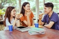 Students asian group together eating pizza in breaking time Royalty Free Stock Photo