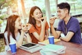 Students asian group together eating pizza in breaking time Royalty Free Stock Photo