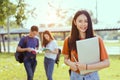 Students asian portrait together smiling group reading book Royalty Free Stock Photo