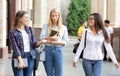 Students avoid talking to friend, walking in college campus Royalty Free Stock Photo