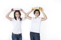 Students are balancing heavy books on the heads