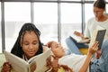 Students, books and library in college to reading, relax and learning for girl friends. Education, study and scholarship