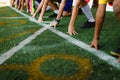 Students boy get set to leaving the starting for running competition boy at school sports day. Royalty Free Stock Photo