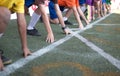 Students boy get set to leaving the starting for running competition boy at school sports day. Royalty Free Stock Photo