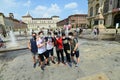 Students celebrating the last school day taking ritual shower in downtown fountain