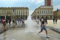 Students celebrating the last school day taking ritual shower in downtown fountain