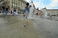 Students celebrating the last school day taking ritual shower in downtown fountain