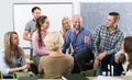 Students chatting at training session for employees during break Royalty Free Stock Photo