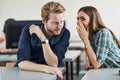 Students cheating by whispering to each other Royalty Free Stock Photo