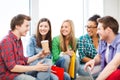 Students communicating and laughing at school Royalty Free Stock Photo