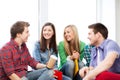 Students communicating and laughing at school Royalty Free Stock Photo