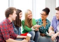 Students communicating and laughing at school Royalty Free Stock Photo