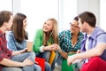 Students communicating and laughing at school Royalty Free Stock Photo