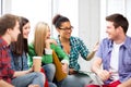 Students communicating and laughing at school Royalty Free Stock Photo