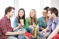 Students communicating and laughing at school Royalty Free Stock Photo