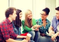 Students communicating and laughing at school Royalty Free Stock Photo