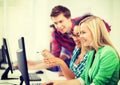 Students with computer studying at school Royalty Free Stock Photo