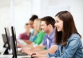 Students with computers studying at school Royalty Free Stock Photo