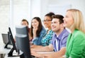 Students with computers studying at school Royalty Free Stock Photo