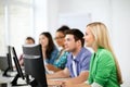 Students with computers studying at school Royalty Free Stock Photo