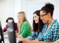 Students with computers studying at school Royalty Free Stock Photo