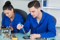 Students in computing class fixing hardware Royalty Free Stock Photo