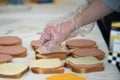 Students of coworkers making food for charity or homeless people