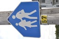 Students crossing the street sign