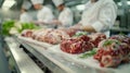 Students at a culinary school learn meat preparation with fresh beef cuts Royalty Free Stock Photo