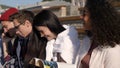 Students debate over their homework sitting near the univesity.