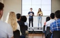 Students With Digital Tablets Giving Presentation To High School Class In Front Of Screen Royalty Free Stock Photo