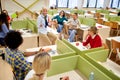 Students enjoying relaxed lecture by female professor. Smart young people study at the college. Education, college, university, Royalty Free Stock Photo