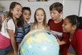 Students Examining Globe Royalty Free Stock Photo