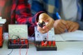 Students experiment with simple electronic circuits.
