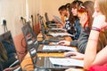 Students in front of computers in a computer class.