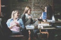 Students girls in cafe having funny conversation. Royalty Free Stock Photo