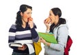 Students girls discuss and eating apples