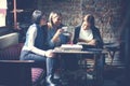 Students girls having fun in cafe. Royalty Free Stock Photo