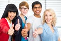 Students giving the thumbs-up sign Royalty Free Stock Photo