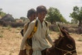 Students are going to schools on donkey in Tharparkar Sindh. Royalty Free Stock Photo