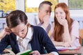 Students gossip on a lesson Royalty Free Stock Photo