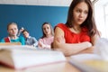 Students gossiping behind classmate back at school