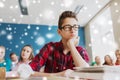 Students gossiping behind classmate back at school Royalty Free Stock Photo