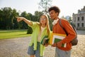 Students gossiping together standing at university campus backyard Royalty Free Stock Photo