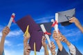 Students graduates with hats and diplomas