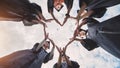Students graduating from the college make a heart out of their hands. Royalty Free Stock Photo