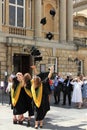 Graduates celebrating near the Roman Baths, Bath, England Royalty Free Stock Photo